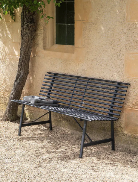 Richmond metal garden bench in black on gravel path