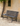 Richmond metal garden bench in black on gravel path