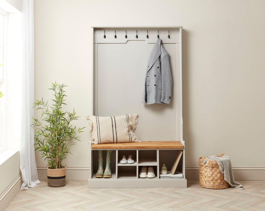 Front view of a tall painted monks bench with welly boot and shoe storage