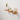 Three-tier oak floating shelf with potted plants and a candle, mounted for a modern home look