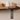 Close-up of a walnut-stained oak shelf showing natural grain and smooth finish.