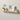 Floating oak shelf styled with books, plants, and candles in a home setting