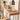 solid wood console table with flowers on top