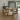 Solid oak dining table with metal legs in a dining room