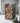 Wicker firewood holder filled with chopped wood against a white wall.