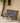 Richmond metal garden bench in black on gravel path