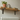 Rustic solid wood radiator shelf with industrial metal brackets, showing the natural grain