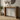 Solid pine radiator console table with wooden legs against a panelled wall