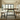 Industrial steel A frame dining table leg detail showing angled structure and clean metal finish