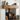 Wood-burning stove with wooden mantel and firewood in a room.