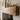 Deep profile oak mantel beam styled with candles above a wood burner