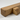 A close-up of a Rustic oak beam shelf with corbels, showing a thick rectangular beam resting on a triangular support block, crafted from natural oak wood with visible grain and knots.