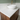 White solid surface countertop on the dark wood vanity unit