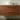 Close grain of the solid Sapele on the dark wood wall hung vanity unit