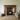 Handmade wooden fire surround above wood burning stove, rustic pine with natural character and a dark finish