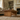 farmhouse coffee table in a living room with a sofa, bookshelf, and fireplace.