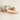 Close up of a rustic pine floating radiator shelf showing the grain
