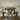 black steel x frame dining table legs supporting solid oak tabletop detail