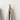 Wooden hook with striped towels on a white background