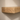 Close up of the narrow oak floating shelf showing the grain and the 5cm thick front edge