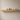 Narrow oak floating shelf mounted on a wall, slim solid oak with concealed fixings and no visible brackets