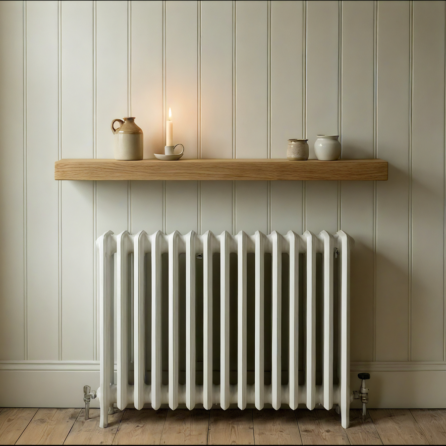 Narrow oak radiator shelf mounted above a radiator, slim solid oak with no visible brackets