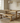 solid oak dining benches tucked under pedestal table showing space underneath and clean base layout