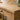 Close up of the solid oak top and drawer front on the oak console table, showing the grain