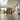 side view of oak dining table with a frame legs and dining chairs