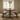 side view of solid oak dining table and bench set with pedestal base and smooth top showing proportions and two benches