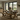 side view of solid oak dining table with x frame legs and matching bench
