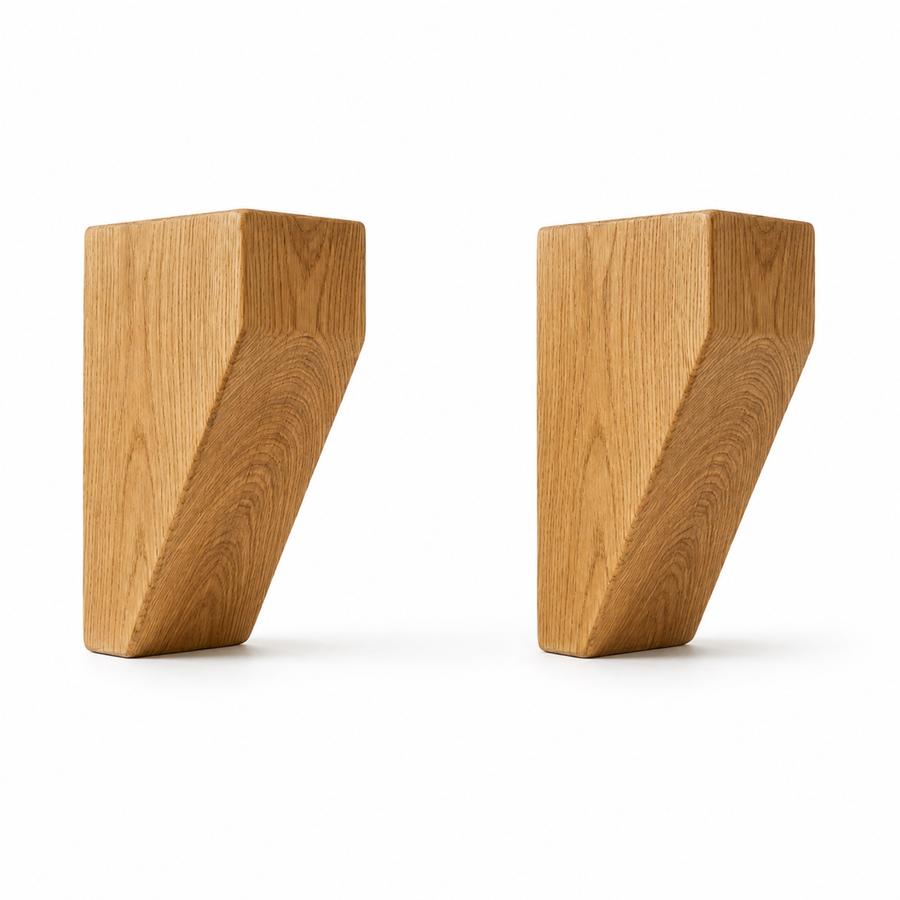Solid oak mantel corbels supporting a shelf above a fireplace, showing the curved front profile