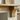 Oak mantel shelf with corbels above a fireplace and chimney breast