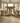 low angle view of solid oak dining table and benches showing T leg base and central stretcher support