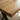 close up of solid oak dining table top showing natural grain detail and oil finish