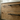 White Corian worktop with a sit-on basin on the oak vanity unit