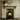 Pine corbel mantel shelf in a dark grey finish above a log burner