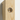 Close up of a decorative pine corbel, showing its carved scroll shape and pine grain