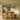 side view of chunky pine farmhouse dining table and benches showing proportions and heavy leg design