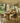 rustic pine pedestal dining table with plank top and solid block base styled with dining chairs in farmhouse kitchen setting