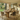 rustic pine pedestal dining table with plank top and solid block base styled with dining chairs in farmhouse kitchen setting