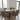round wooden dining table with hairpin legs in small dining space
