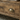 Two drawers and a full-width open shelf on the rustic double vanity unit