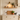 Deep oak floating shelf in a rustic finish, wall mounted above a marble worktop