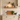 Solid oak floating shelf, 19.5cm deep, styled with kitchenware on a rustic wall