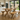 rustic pine dining table and bench set with x frame legs in bright dining room with natural light and garden view