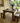 Rustic pine farmhouse dining table and bench set with straight legs in a bright kitchen with natural light and garden view