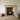 Rustic pine fire surround installed above a wood burning stove, stone chimney breast, natural finish