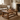rustic wooden coffee table with decorative items in a cosy living room.