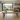 side view of oak dining table and bench set showing metal legs and table profile